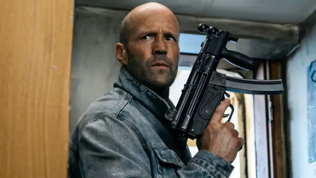 Man holding a gun in a tense scene from Mutiny Movie Tasting.